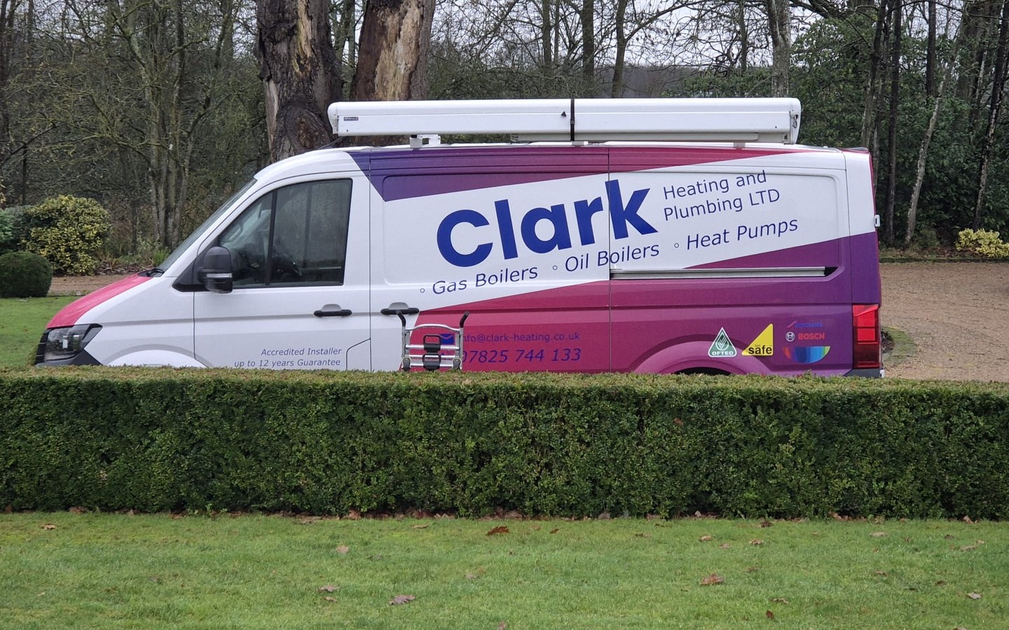 Clark Heating and Plumbing Ltd van in purple, magenta and blue livery